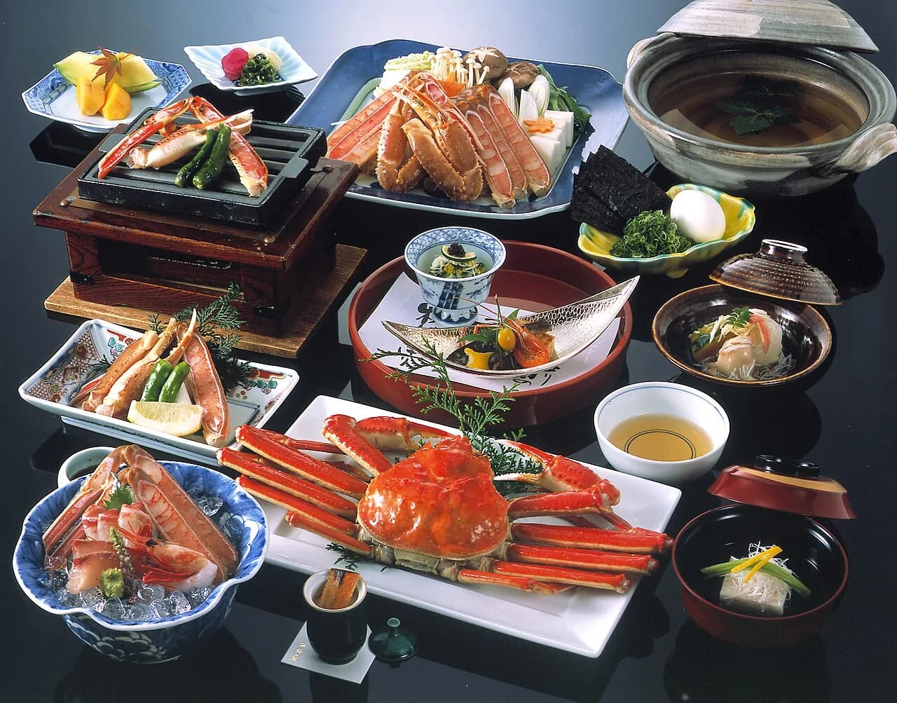 A crab full course at Nishimuraya: a whole boiled snow crab, crab sashimi on ice, grilled legs and a hotpot
