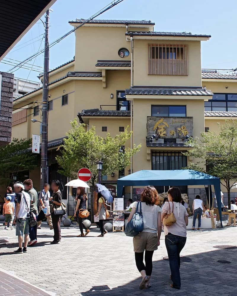 The Kin no Yu public bathhouse on a sloping street in Arima Onsen