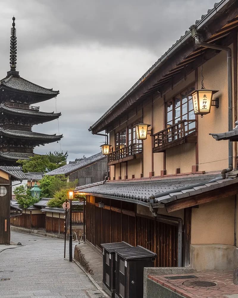The five-storey Yasaka Pagoda at the end of a stone-paved lane of wooden townhouses in Higashiyama, Kyoto, early morning