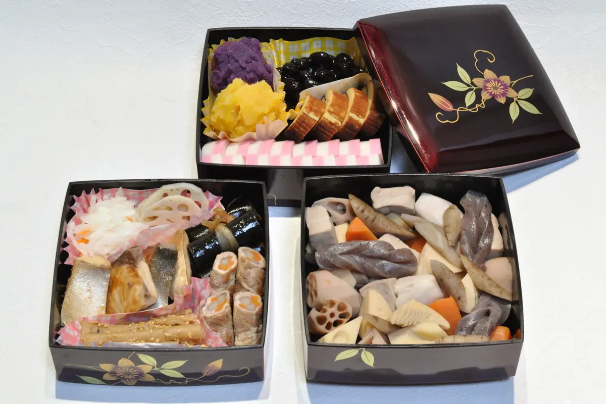 Osechi New Year food packed in lacquered jubako boxes